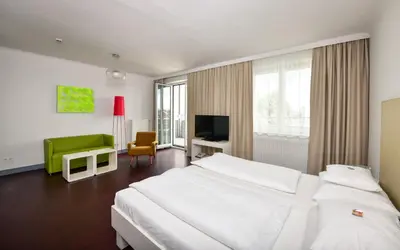 Ein Bett oder Betten in einem Zimmer der Unterkunft Stanys - Das Apartmenthotel