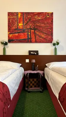 Ein Bett oder Betten in einem Zimmer der Unterkunft Pension Stadthalle