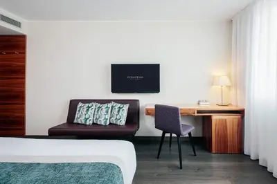 Ein Bett oder Betten in einem Zimmer der Unterkunft Eurostars Embassy