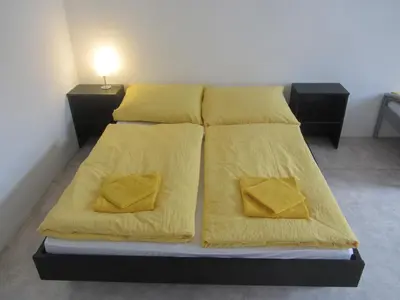 Ein Bett oder Betten in einem Zimmer der Unterkunft Apartments Nora
