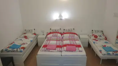 Ein Bett oder Betten in einem Zimmer der Unterkunft Apartments Nora