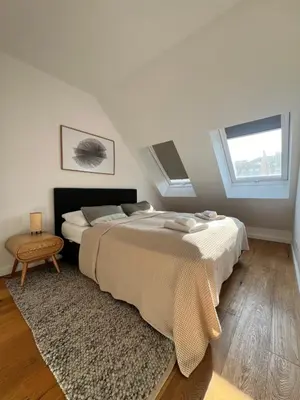 Ein Bett oder Betten in einem Zimmer der Unterkunft DOWA Apartments