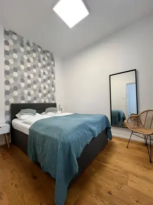 Ein Bett oder Betten in einem Zimmer der Unterkunft DOWA Apartments