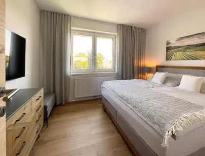 Ein Bett oder Betten in einem Zimmer der Unterkunft Haderer's Home - Bad Vöslau near Vienna