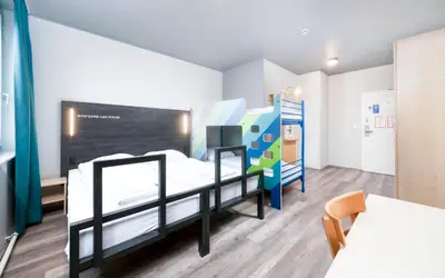 Ein Bett oder Betten in einem Zimmer der Unterkunft a&o Wien Stadthalle