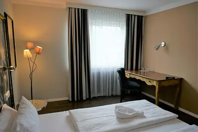 Ein Bett oder Betten in einem Zimmer der Unterkunft Hotel Calmo