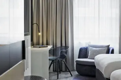 Ein Bett oder Betten in einem Zimmer der Unterkunft Renaissance Vienna Schönbrunn Hotel