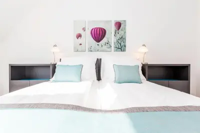 Ein Bett oder Betten in einem Zimmer der Unterkunft Simtown Suite Apartments