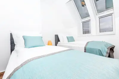 Ein Bett oder Betten in einem Zimmer der Unterkunft Simtown Suite Apartments