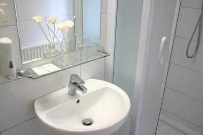 Ein Badezimmer in der Unterkunft Hotel Korotan