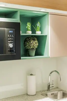 Küche/Küchenzeile in der Unterkunft ZEUS Design Mini Apartment Erlach #10