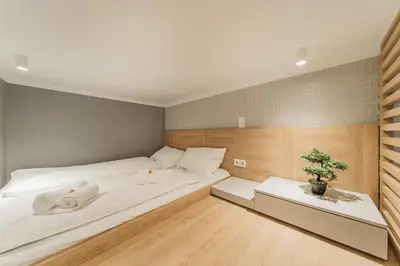 Ein Bett oder Betten in einem Zimmer der Unterkunft ZEUS Design Mini Holliday Embel #23