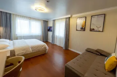 Ein Bett oder Betten in einem Zimmer der Unterkunft Mr.Liao Hotel