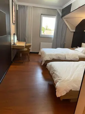 Ein Bett oder Betten in einem Zimmer der Unterkunft Mr.Liao Hotel