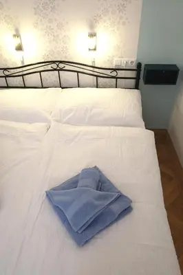 Ein Bett oder Betten in einem Zimmer der Unterkunft Sobieski Stefansdom Apartments