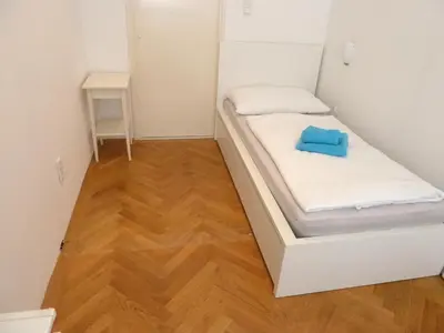 Ein Bett oder Betten in einem Zimmer der Unterkunft Sobieski Stefansdom Apartments