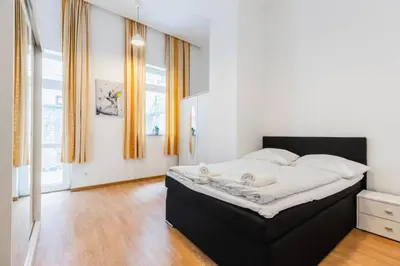 Ein Bett oder Betten in einem Zimmer der Unterkunft Family apartment next to Danube river
