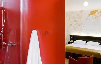 Ein Bett oder Betten in einem Zimmer der Unterkunft Alma Boutique-Hotel