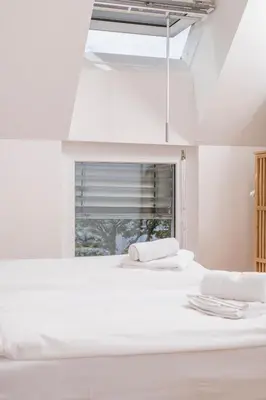 Ein Bett oder Betten in einem Zimmer der Unterkunft Micro Rooftop Penzing