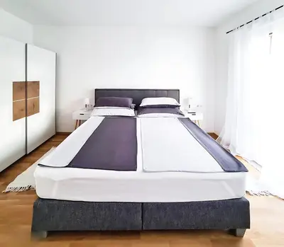 Ein Bett oder Betten in einem Zimmer der Unterkunft Relax Suite