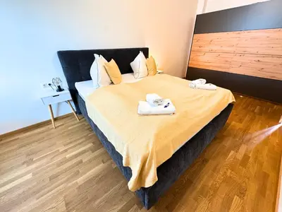 Ein Bett oder Betten in einem Zimmer der Unterkunft Lake View Suite