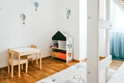 Ein Bett oder Betten in einem Zimmer der Unterkunft Family Suite