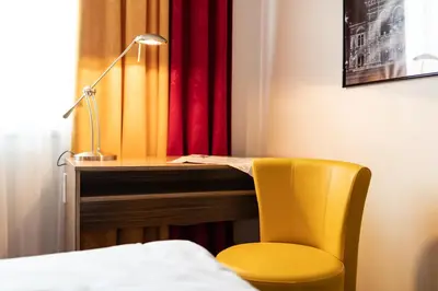 Ein Bett oder Betten in einem Zimmer der Unterkunft Senator Hotel Vienna