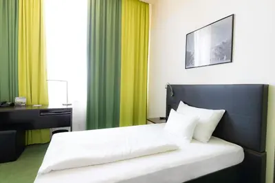 Ein Bett oder Betten in einem Zimmer der Unterkunft Rainers Hotel Vienna