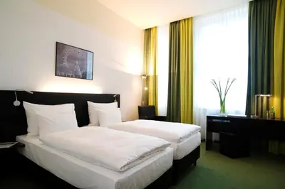 Ein Bett oder Betten in einem Zimmer der Unterkunft Rainers Hotel Vienna
