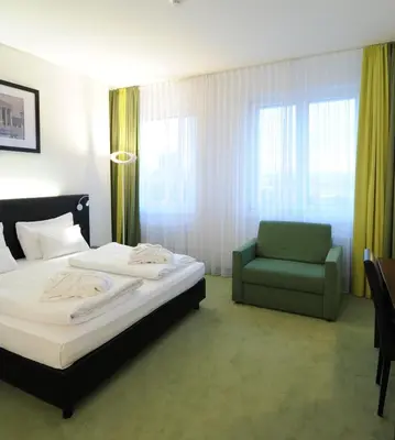 Ein Bett oder Betten in einem Zimmer der Unterkunft Rainers Hotel Vienna