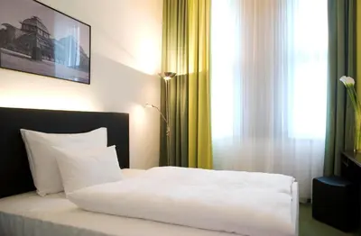 Ein Bett oder Betten in einem Zimmer der Unterkunft Rainers Hotel Vienna
