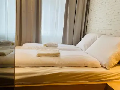 Ein Bett oder Betten in einem Zimmer der Unterkunft ZEUS DESIGN Compact City Aparmtent