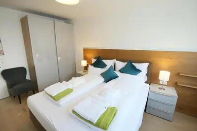 Ein Bett oder Betten in einem Zimmer der Unterkunft Seehaus SeeZeit - Am Hafen