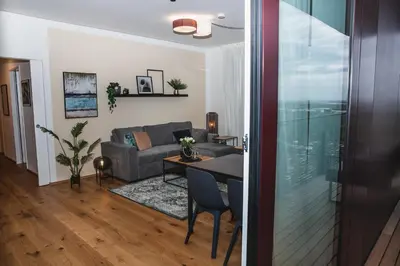 Ein Sitzbereich in der Unterkunft Great apartment with view and heated rooftop Pool