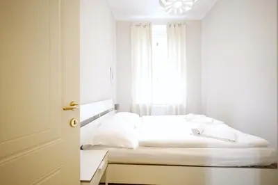 Ein Bett oder Betten in einem Zimmer der Unterkunft HeyMi Apartments Karlsplatz