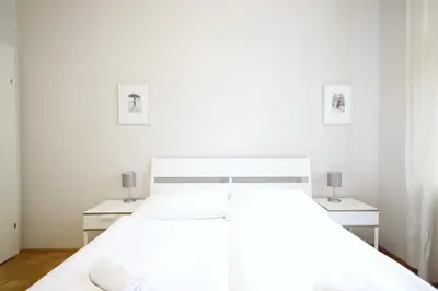 Ein Bett oder Betten in einem Zimmer der Unterkunft HeyMi Apartments Karlsplatz