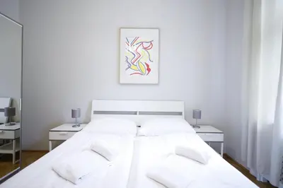 Ein Bett oder Betten in einem Zimmer der Unterkunft HeyMi Apartments Karlsplatz