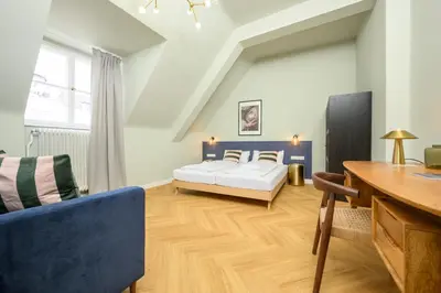 Ein Bett oder Betten in einem Zimmer der Unterkunft Palais Palffy Suits