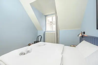 Ein Bett oder Betten in einem Zimmer der Unterkunft Palais Palffy Suits