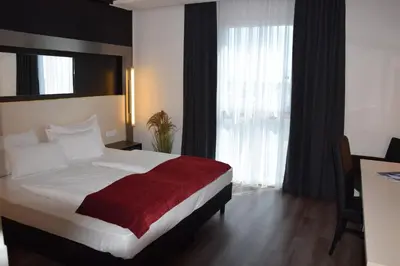 Ein Bett oder Betten in einem Zimmer der Unterkunft Pannonia Tower