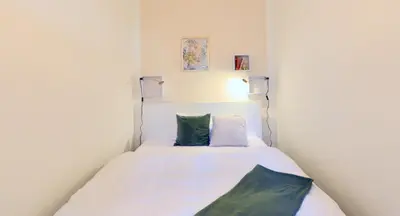 Ein Bett oder Betten in einem Zimmer der Unterkunft Perfect for Families and Mid-Term-Stays