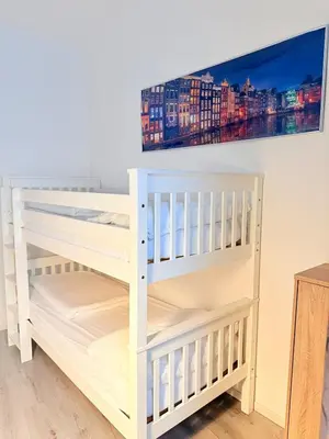 Ein Bett oder Betten in einem Zimmer der Unterkunft Gesamte Unterkunft für 4 Personen Top 3