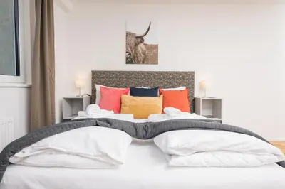 Ein Bett oder Betten in einem Zimmer der Unterkunft Cozy Favoriten