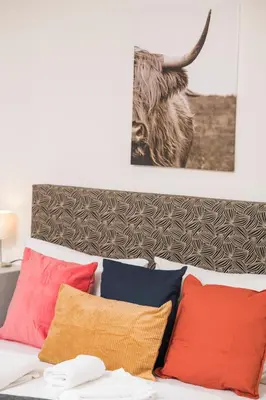 Ein Bett oder Betten in einem Zimmer der Unterkunft Cozy Favoriten