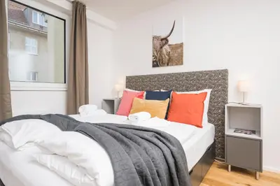 Ein Bett oder Betten in einem Zimmer der Unterkunft Cozy Favoriten