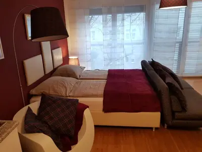 Ein Bett oder Betten in einem Zimmer der Unterkunft BullsLiving Kaisermühlen Apartment Erni next to UNO City