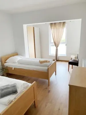 Ein Bett oder Betten in einem Zimmer der Unterkunft Gästezimmer Ödenburgerstraße
