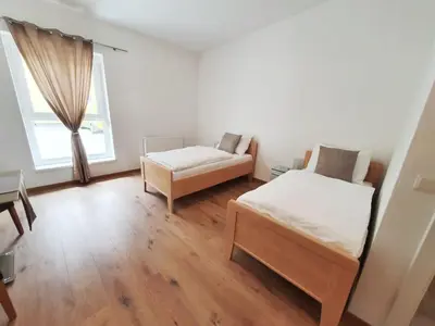 Ein Bett oder Betten in einem Zimmer der Unterkunft Gästezimmer Ödenburgerstraße