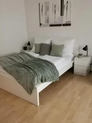 Ein Bett oder Betten in einem Zimmer der Unterkunft Central Alpha Apartment 7min to the city centar