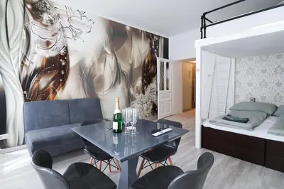 Ein Bett oder Betten in einem Zimmer der Unterkunft CozyNite Premium Apartment Favoriten